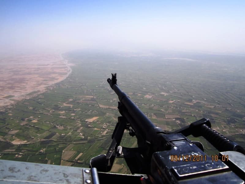 Farmland seen from a helicopter door
