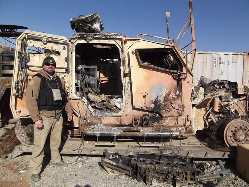 A burnt-out armoured vehicle, stripped by fire
